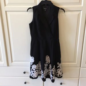Black dress with white trimming at bottom